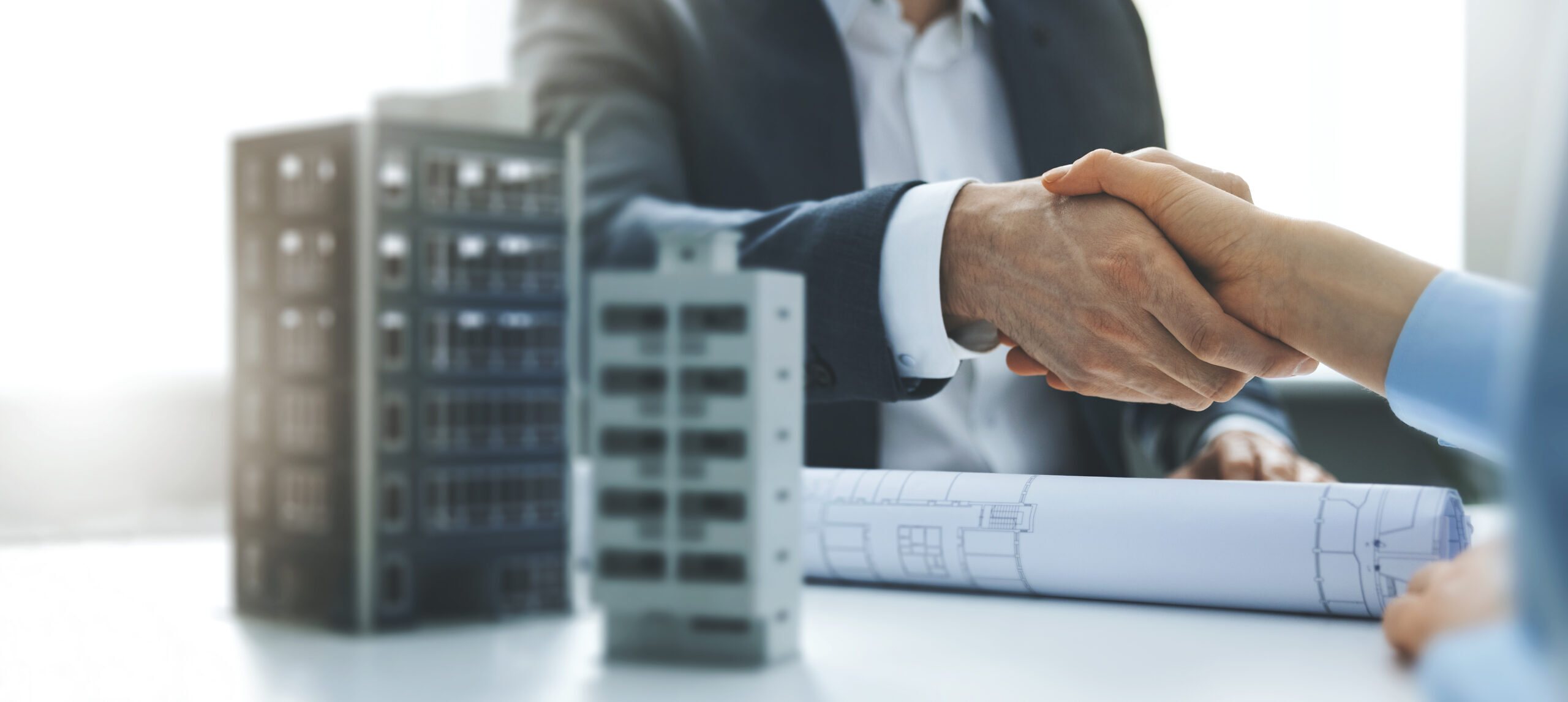 housing development and investment business - businessmen handsh