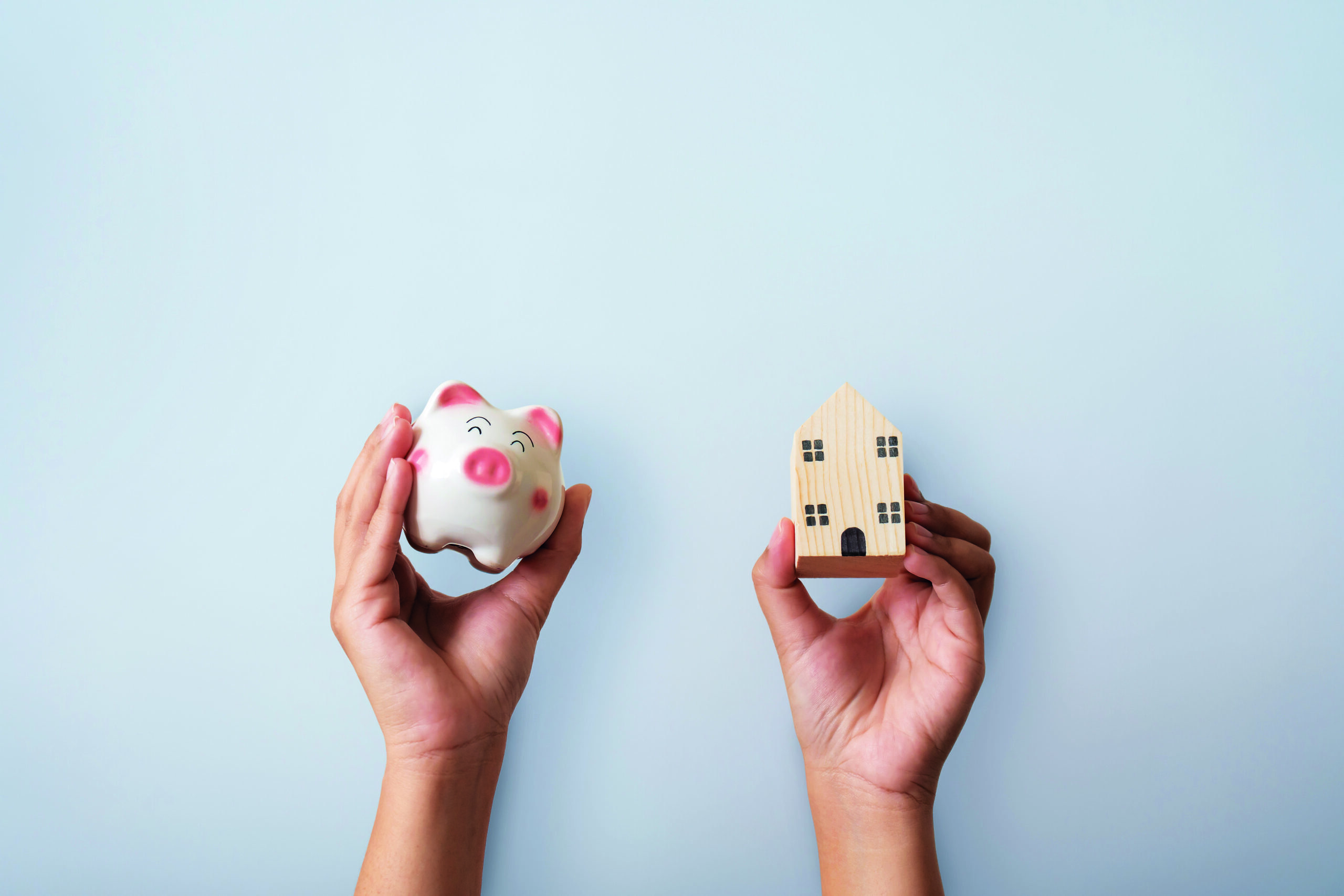 hands-holding-piggy-bank-small-wooden-house-concept-savings-property-investment_ret__